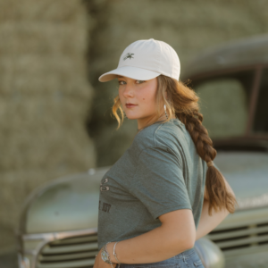 Woman wearing cream Embroidered Open Range Cap by JM Capriola