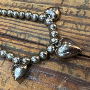 Sterling silver puffy heart charm necklace detail
