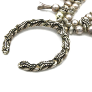 Sterling silver twisted rope naja pendant feather detail close up